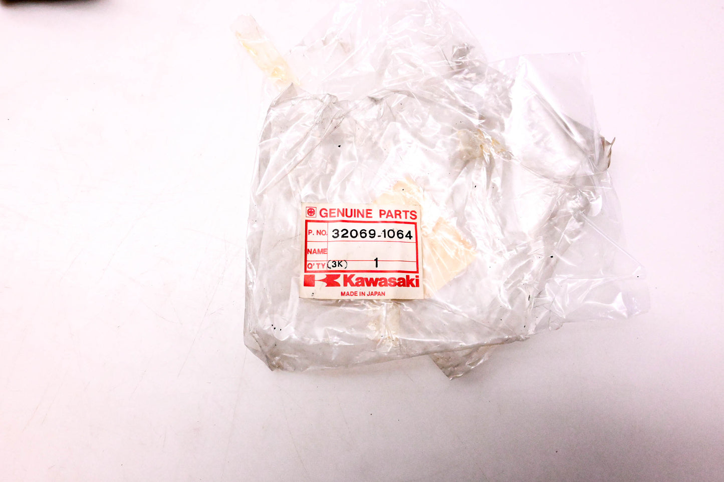 New OEM Kawasaki 32069-1064 Left Hand Side Muffler Bracket NOS