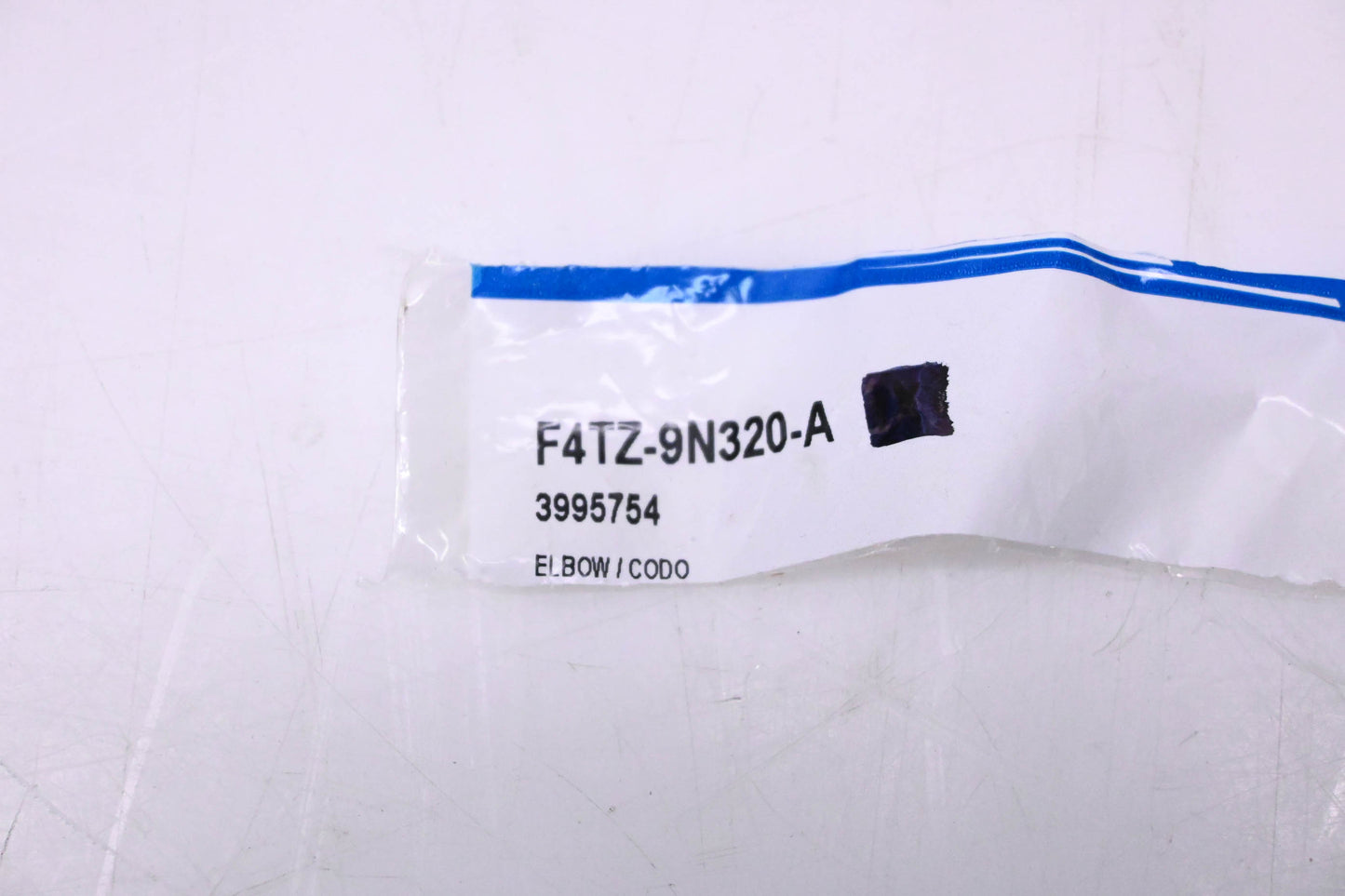 New OEM Ford F4TZ-9N320-A, 3995754 Elbow NOS