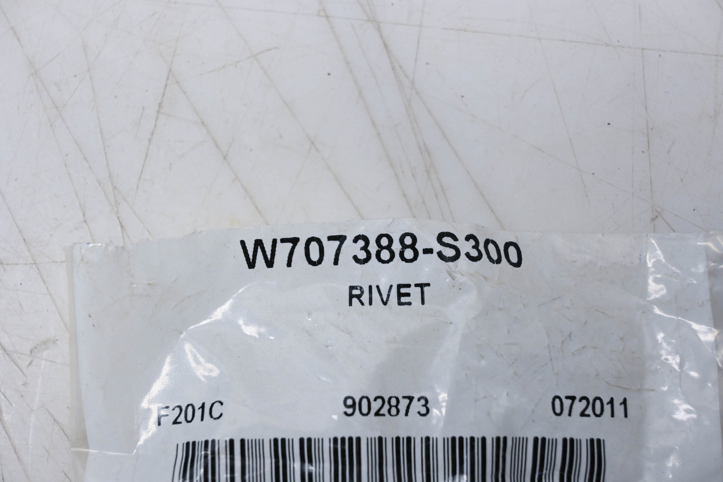 New OEM Ford W707388-S300 Bumper Cover Rivet NOS