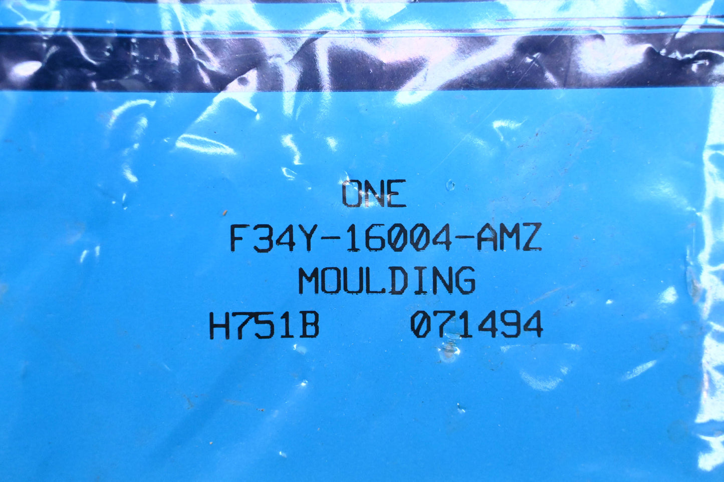 New OEM Ford F34Y-16004-AMZ Moulding Assembly NOS