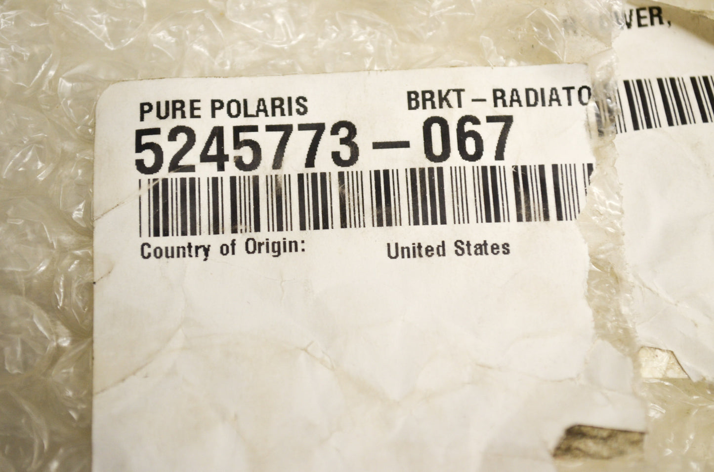 OEM Polaris 5245773-067 Black lower Radiator Bracket NOS