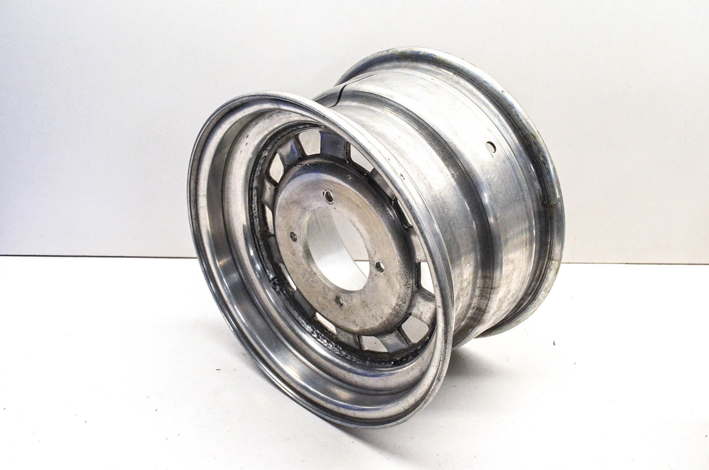 Aftermarket 7x12 Deep Offset 4 Bolt Silver Rear Wheel Rim