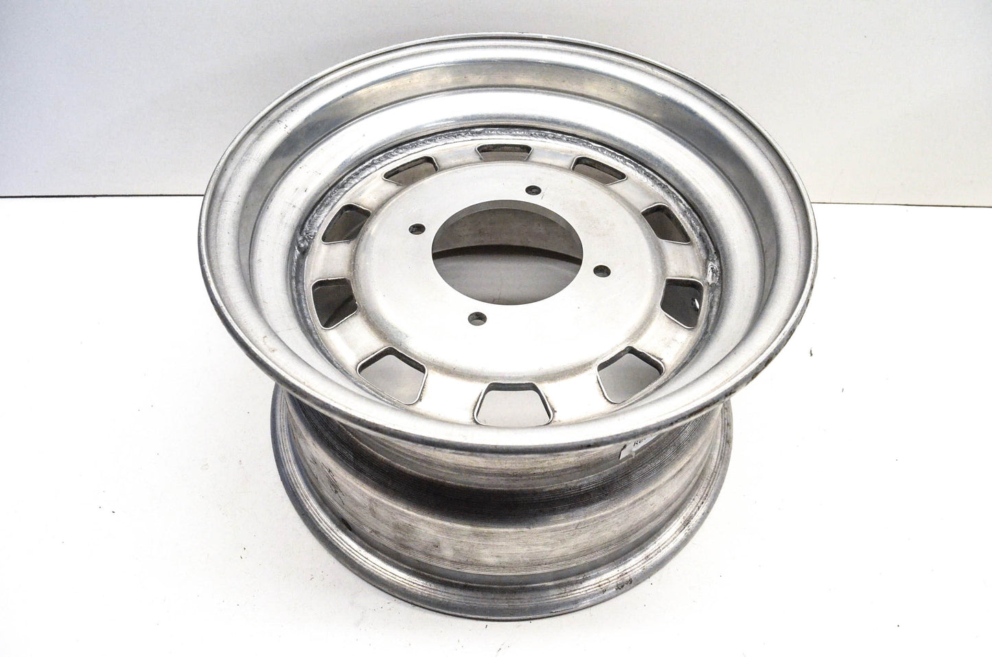 Aftermarket 7x12 Deep Offset 4 Bolt Silver Rear Wheel Rim