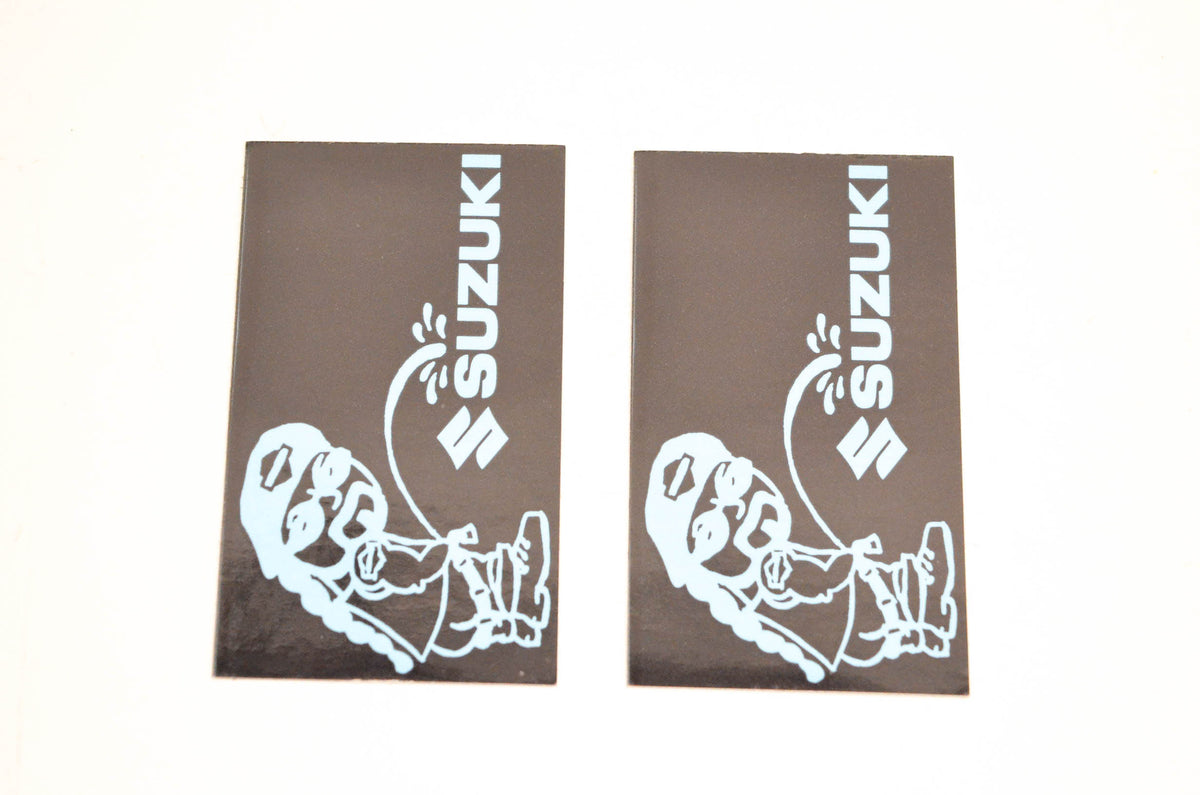 Aftermarket Pee On Suzuki Decals 3"x1-3/4". Qty 2 NOS