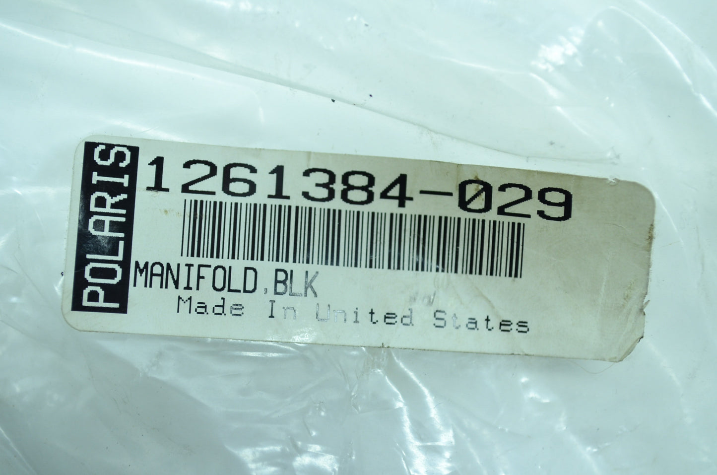 OEM Polaris 1261384-029 Black Manifold NOS