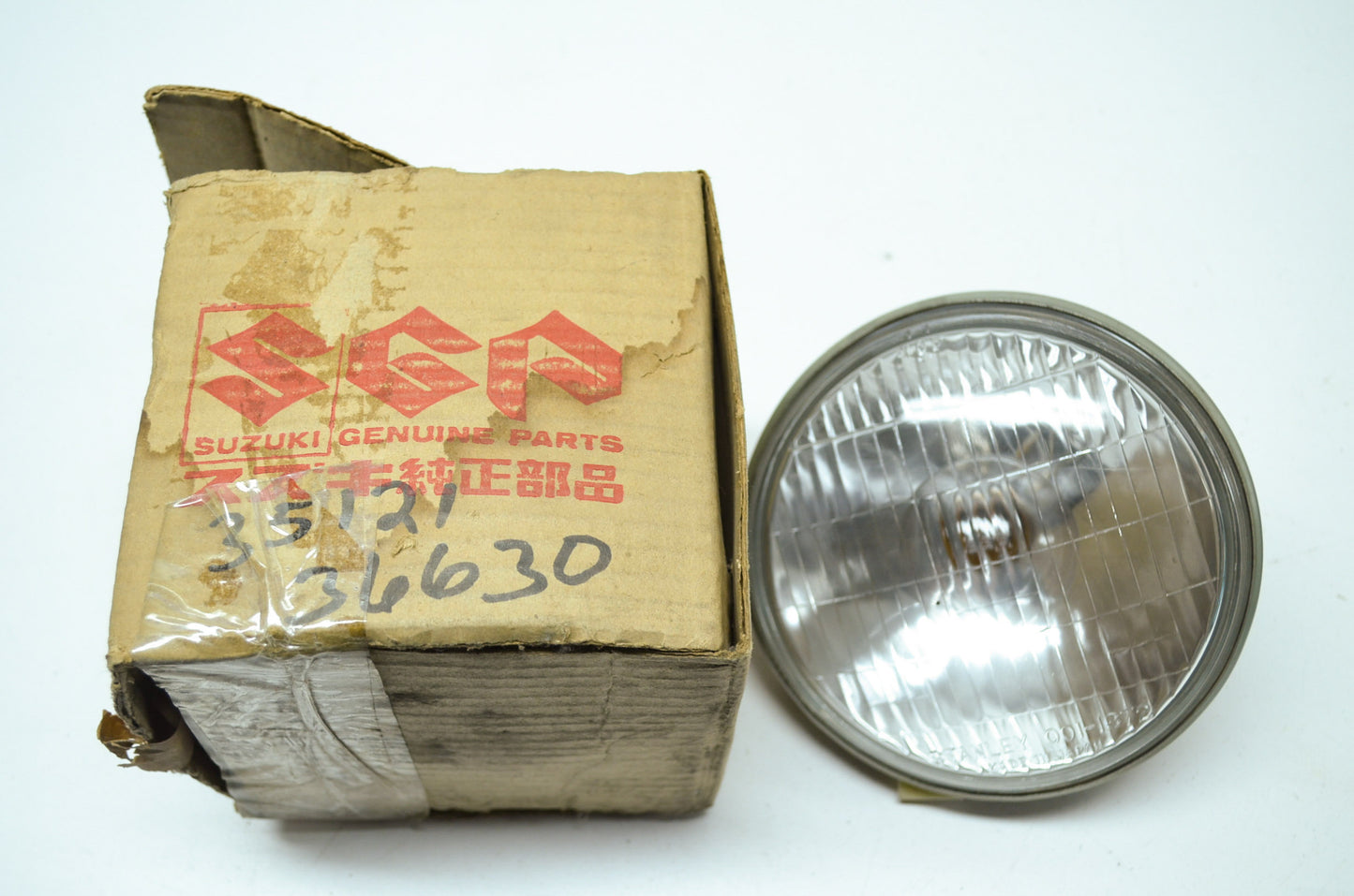 NEW OEM Suzuki Headlight 74-77 TC185 35121-36630 NOS