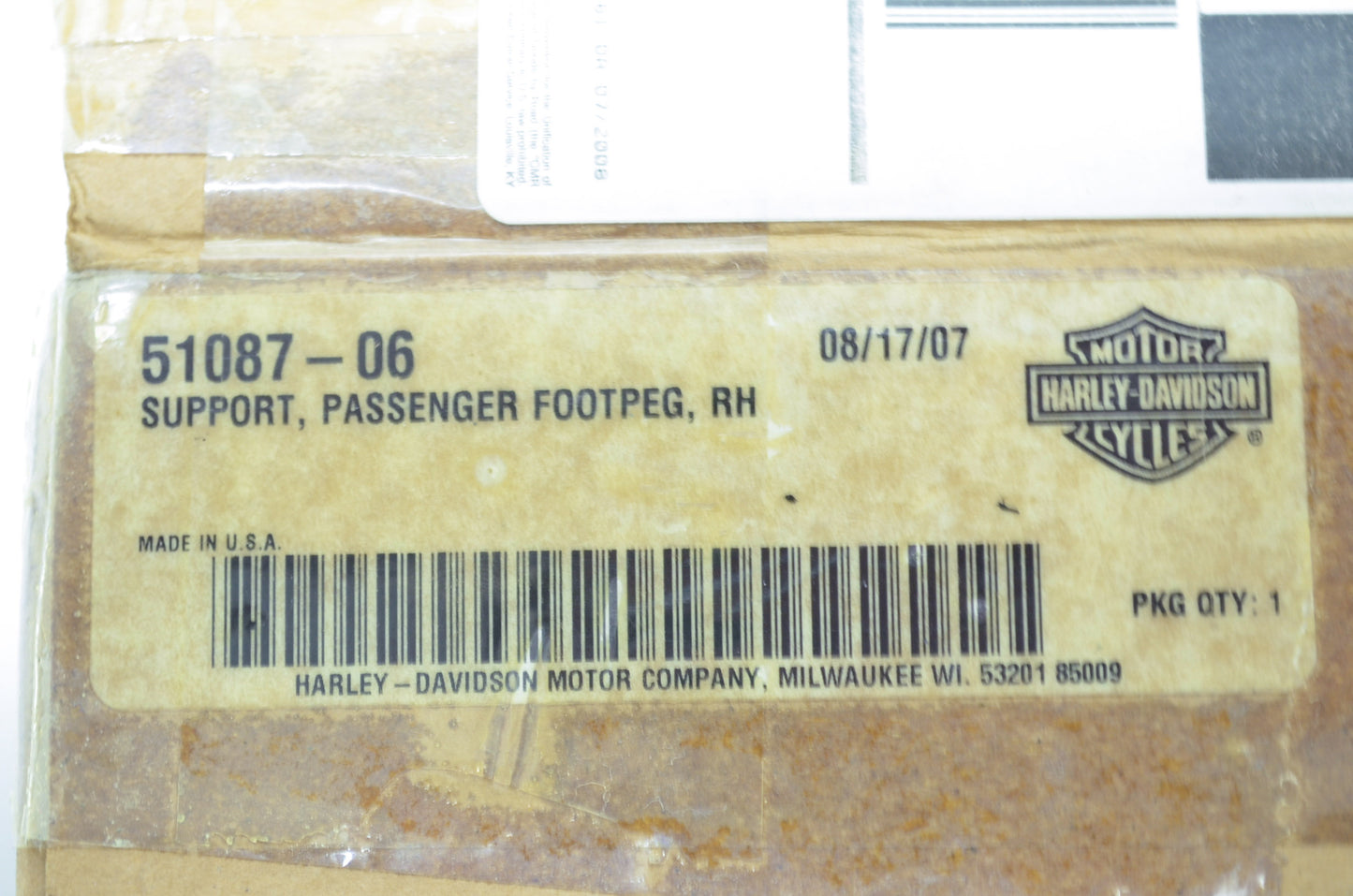 OEM Harley-Davidson 51087-06 Right Passenger Footpeg Support NOS