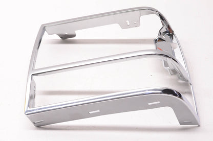 New OEM Ford E97B-13064 LH Headlight Chrome Bezel NOS