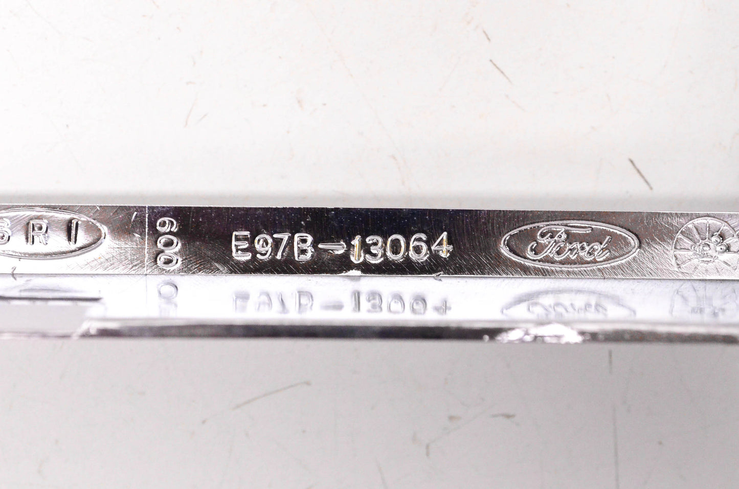 New OEM Ford E97B-13064 LH Headlight Chrome Bezel NOS