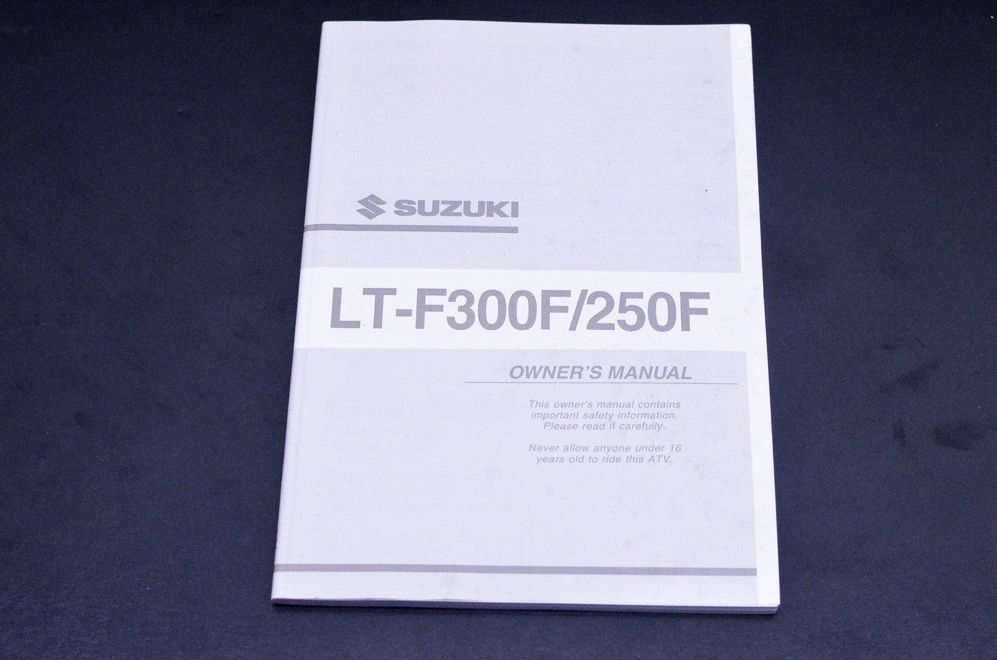 New OEM Suzuki 99011-19B73-03A LT-F300F/250F Owner's Manual NOS