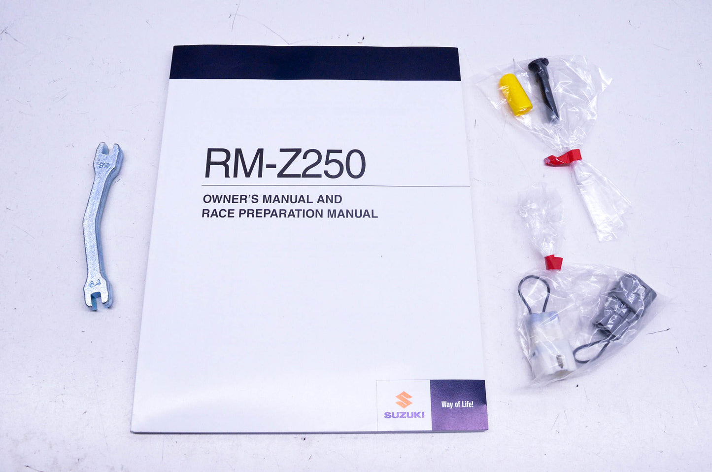 New OEM Suzuki 99011-49H52-03A RM-Z250 Owner's Race Preparation Manual & Hardware Kit NOS