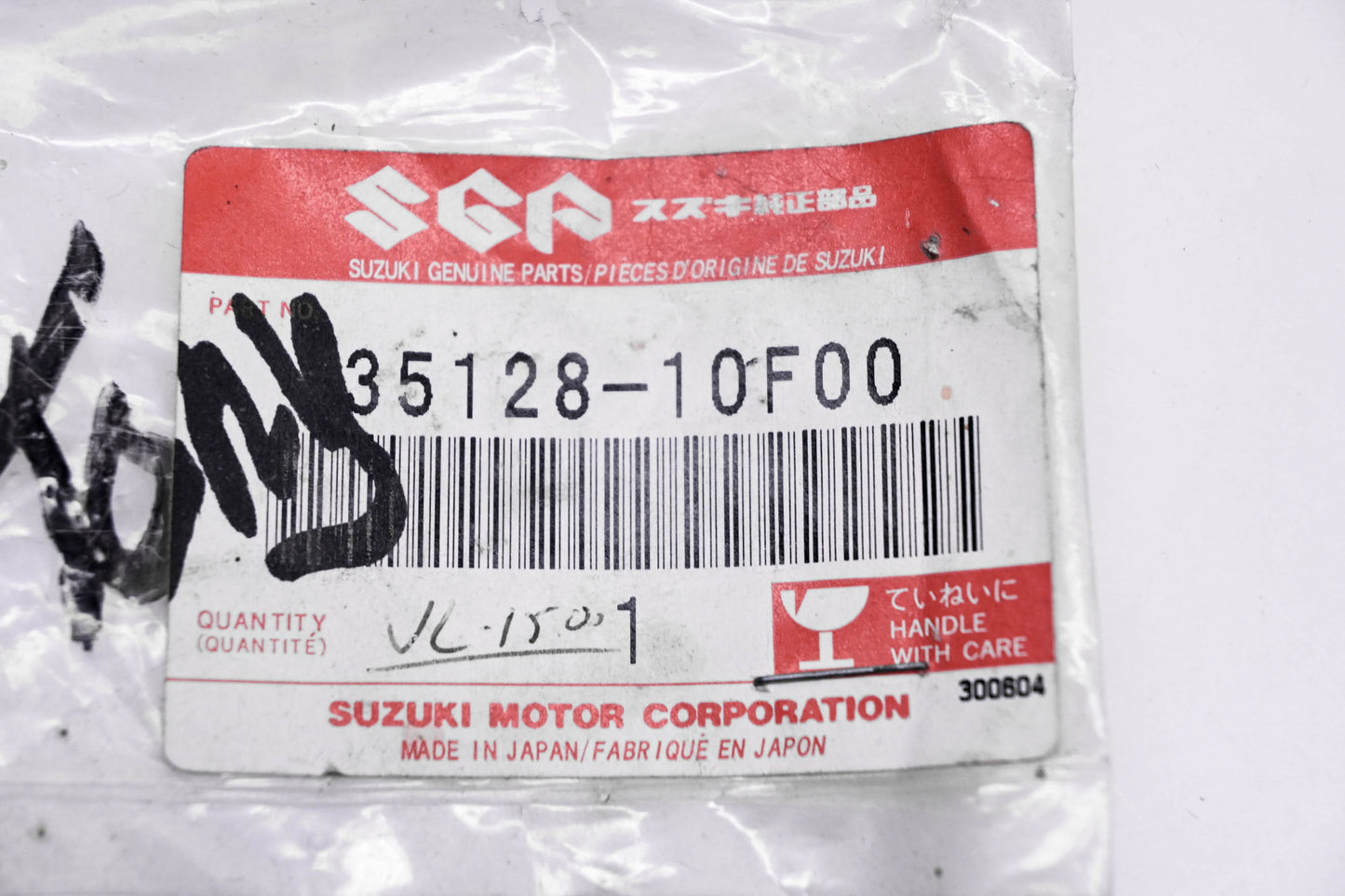 New OEM Suzuki 35128-10F00 Headlight Spring NOS