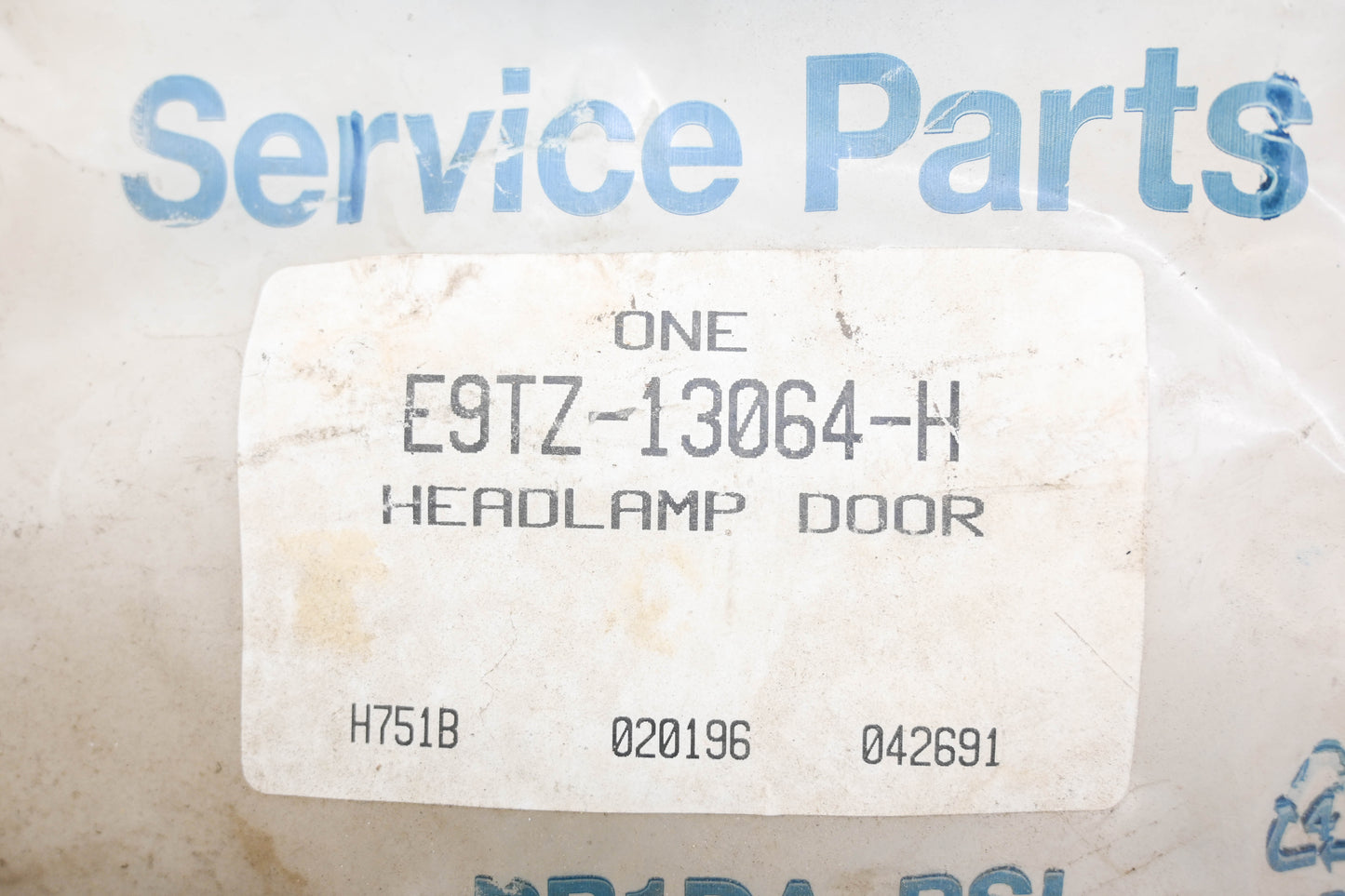 New OEM Ford E9TZ-13064-H Headlamp Door NOS