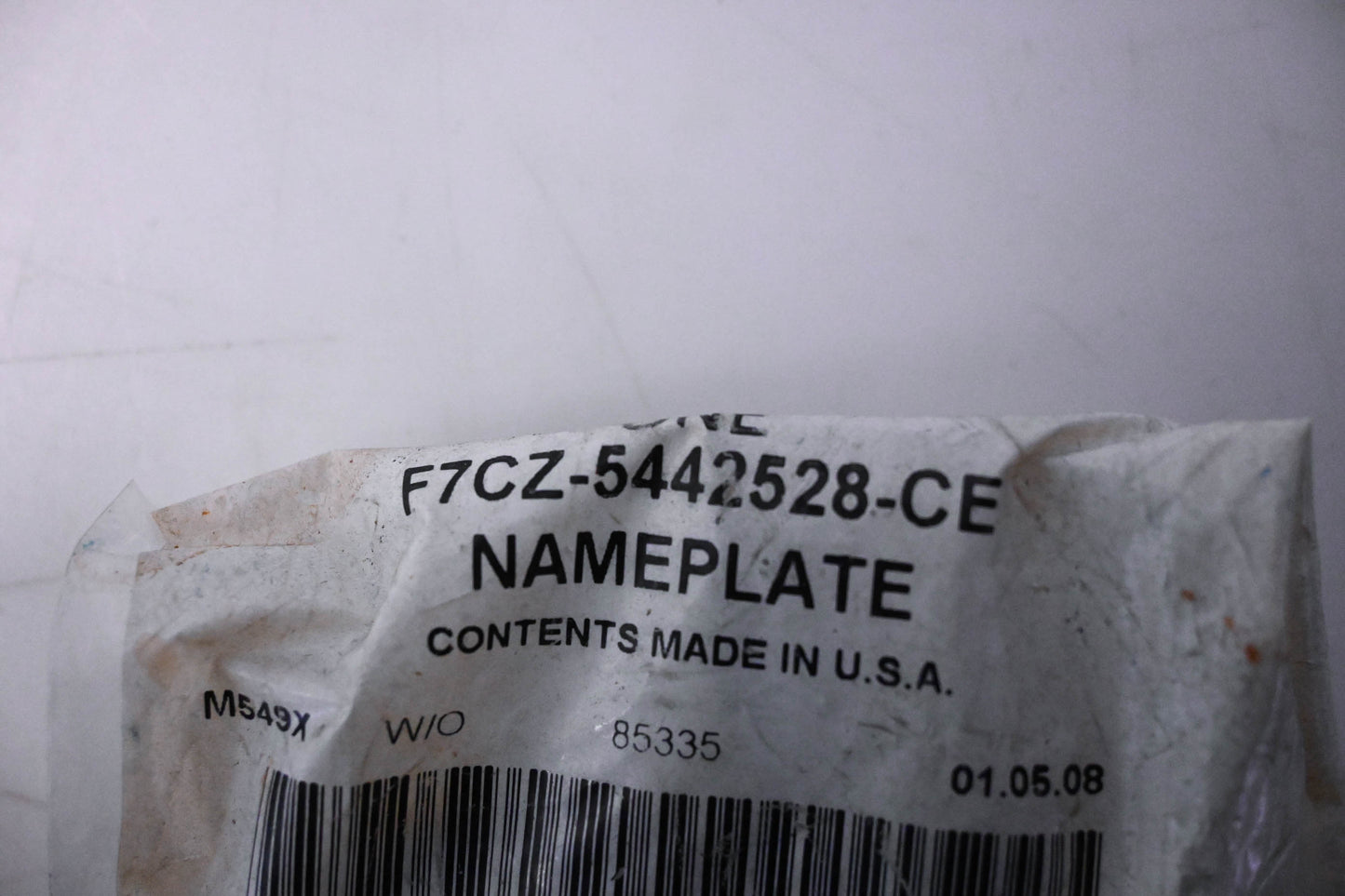 New OEM Ford F7CZ-5442528-CE Escort Nameplate NOS