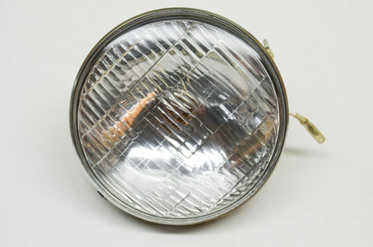 New Tonan Headlight 12v35/25w NOS