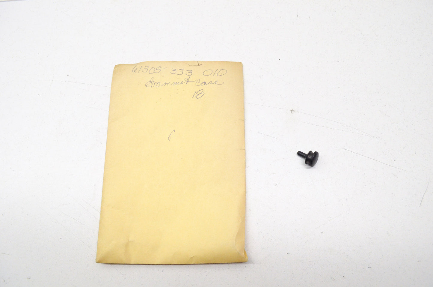 Headlight Case Grommet NOS