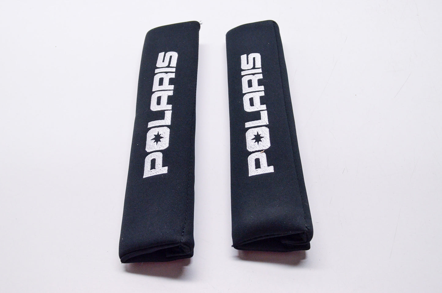 New OEM Polaris Black Neoprene Seat Belt Pad Qty 2 NOS