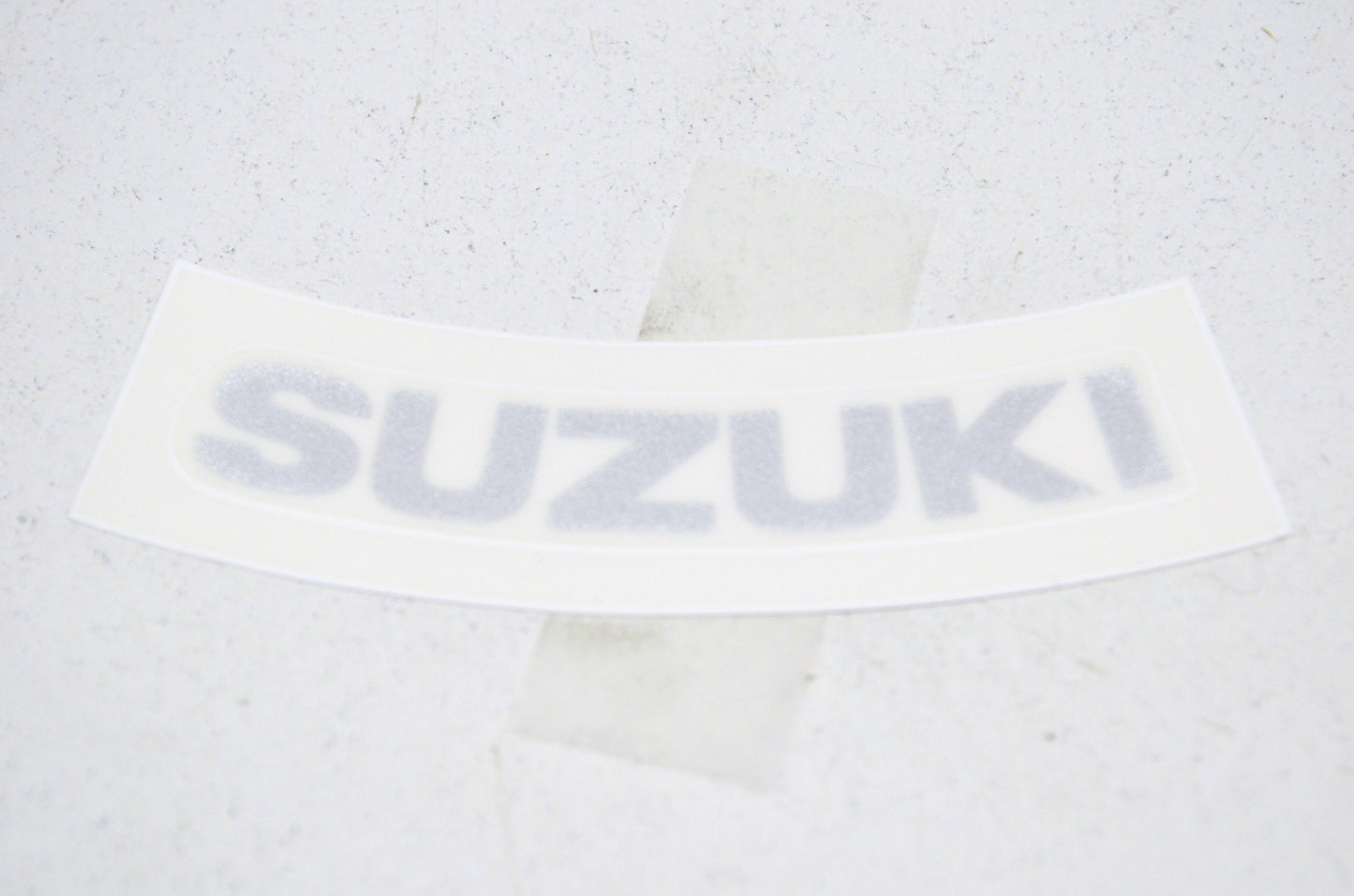 OEM Suzuki 68280-04F00-YD8 Emblem "Suzuki" NOS
