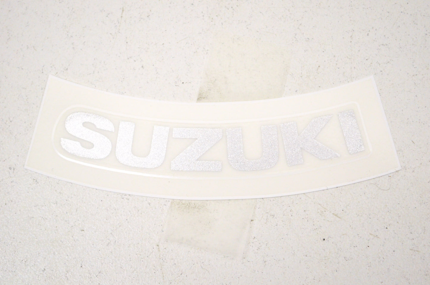 OEM Suzuki 68280-04F00-YD8 Emblem "Suzuki" NOS