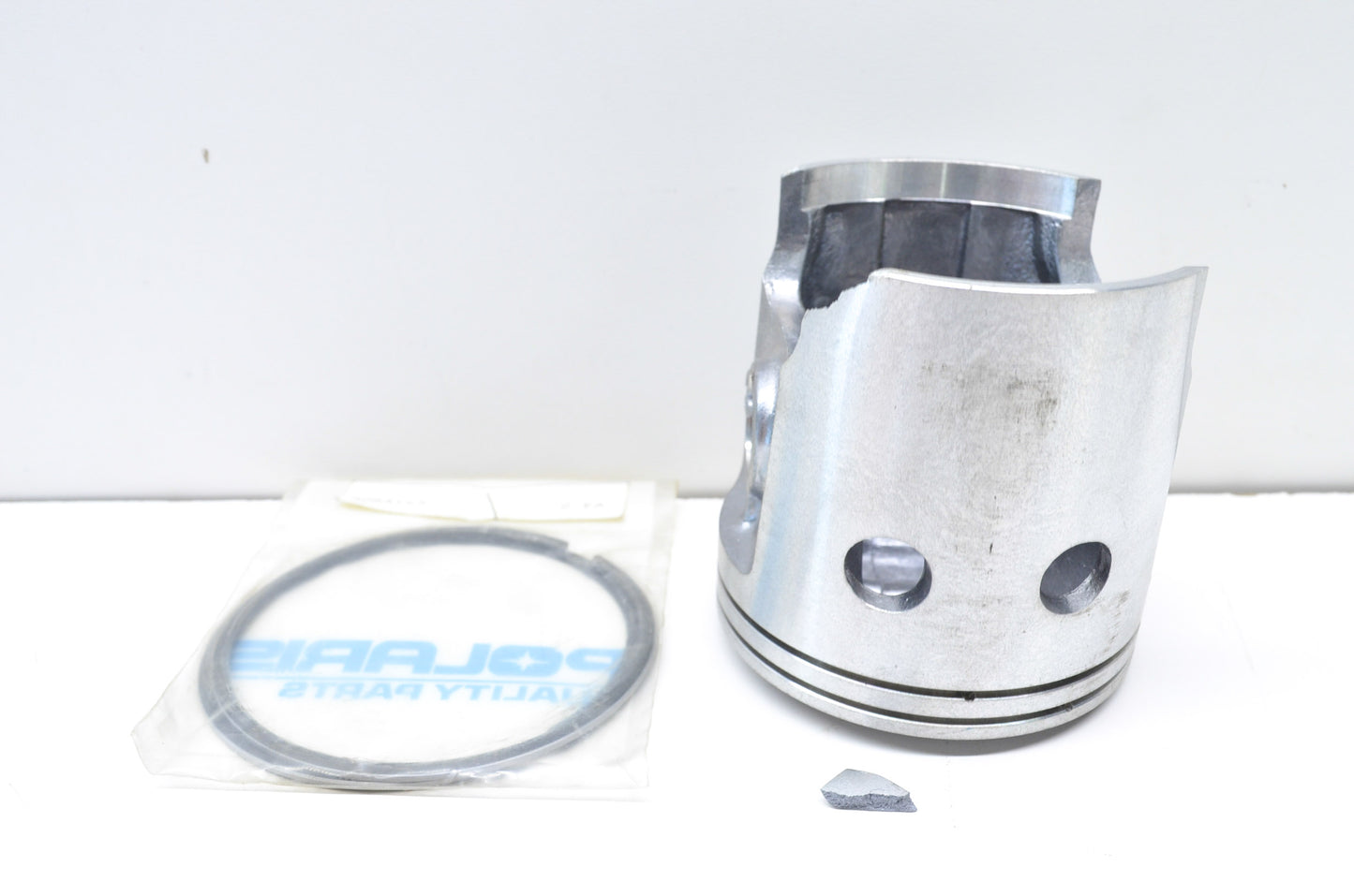 Chipped Piston & 2 Piston Rings NOS