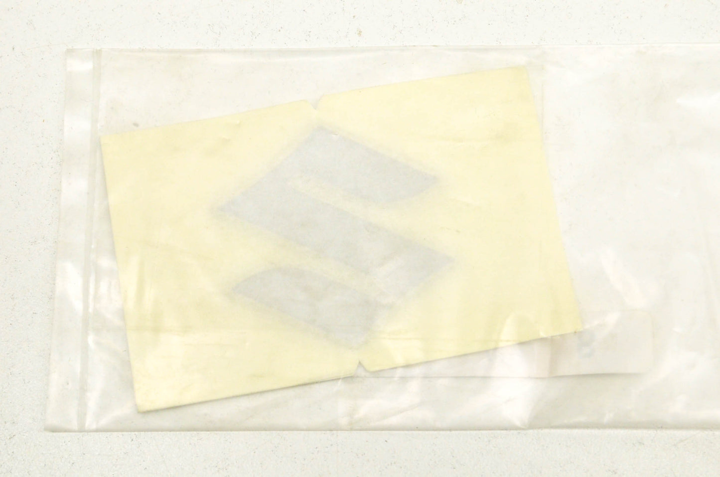 OEM Suzuki 68111-18G20 Emblem "S" NOS