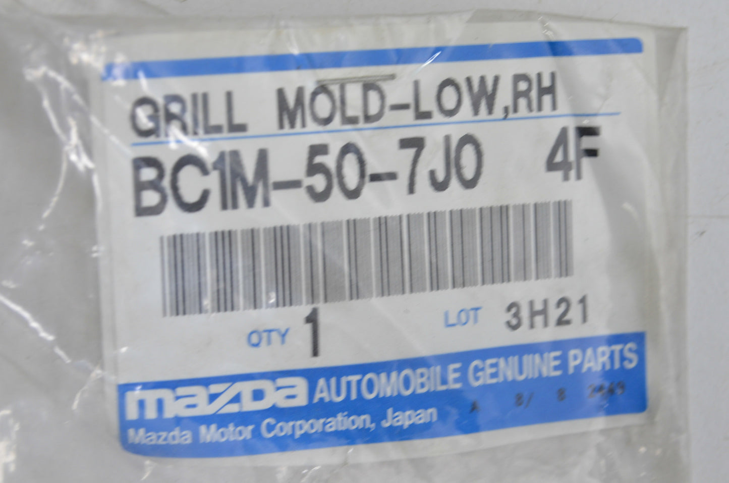 OEM Mazda BC1M-50-7J0 Lower Right Grill Molding NOS