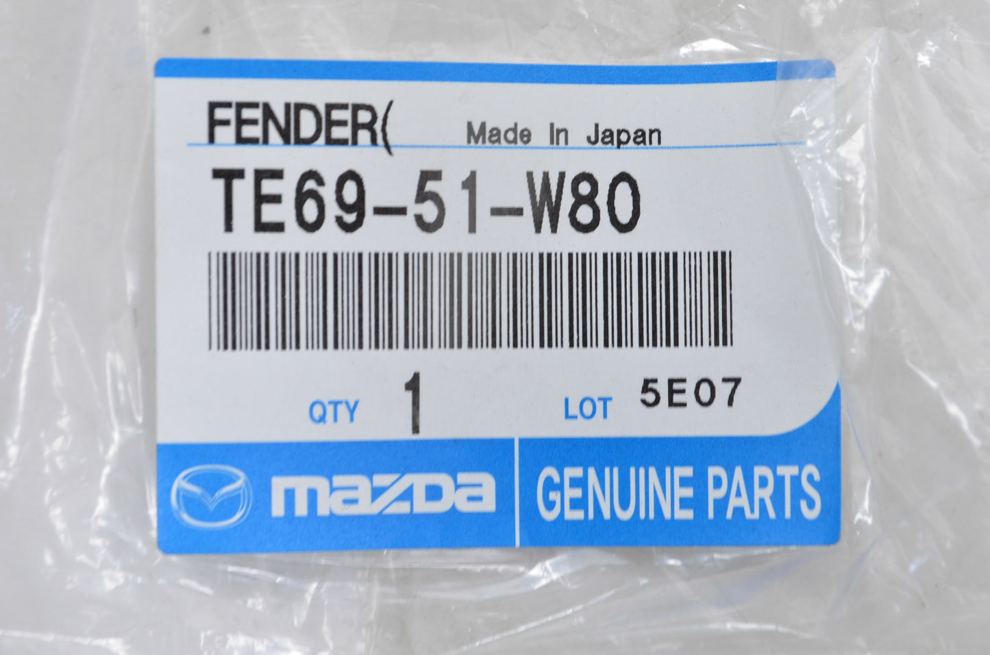 New OEM Mazda Left Driver Bumper Fender Molding NOS