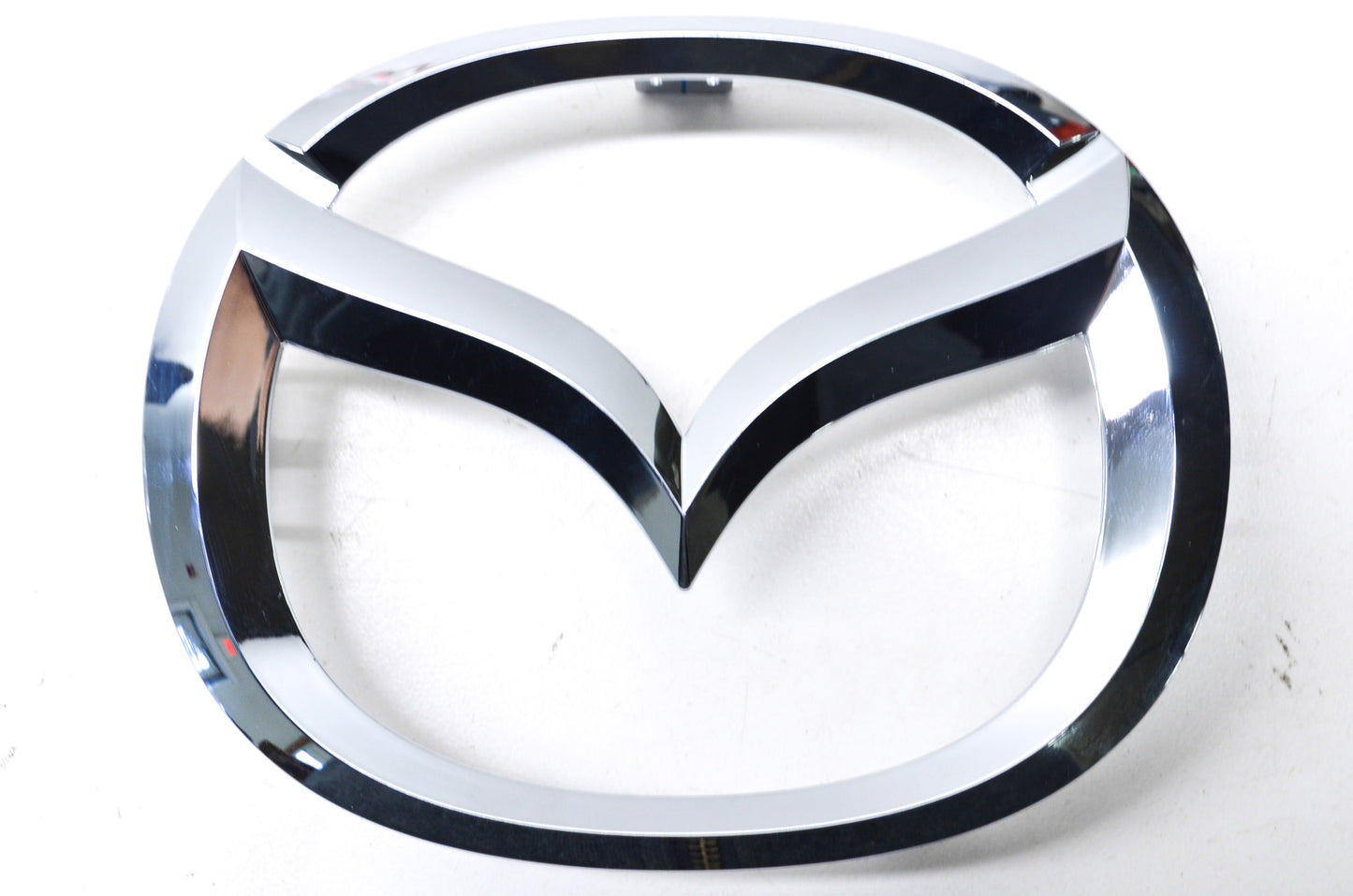 New OEM Mazda Front Grille Emblem Ornament NOS