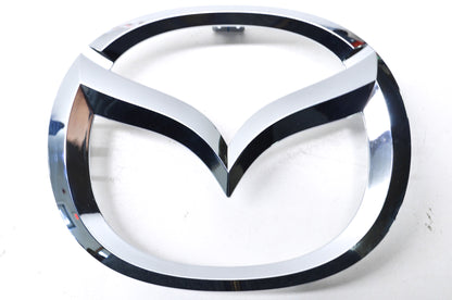 New OEM Mazda Front Grille Emblem Ornament NOS