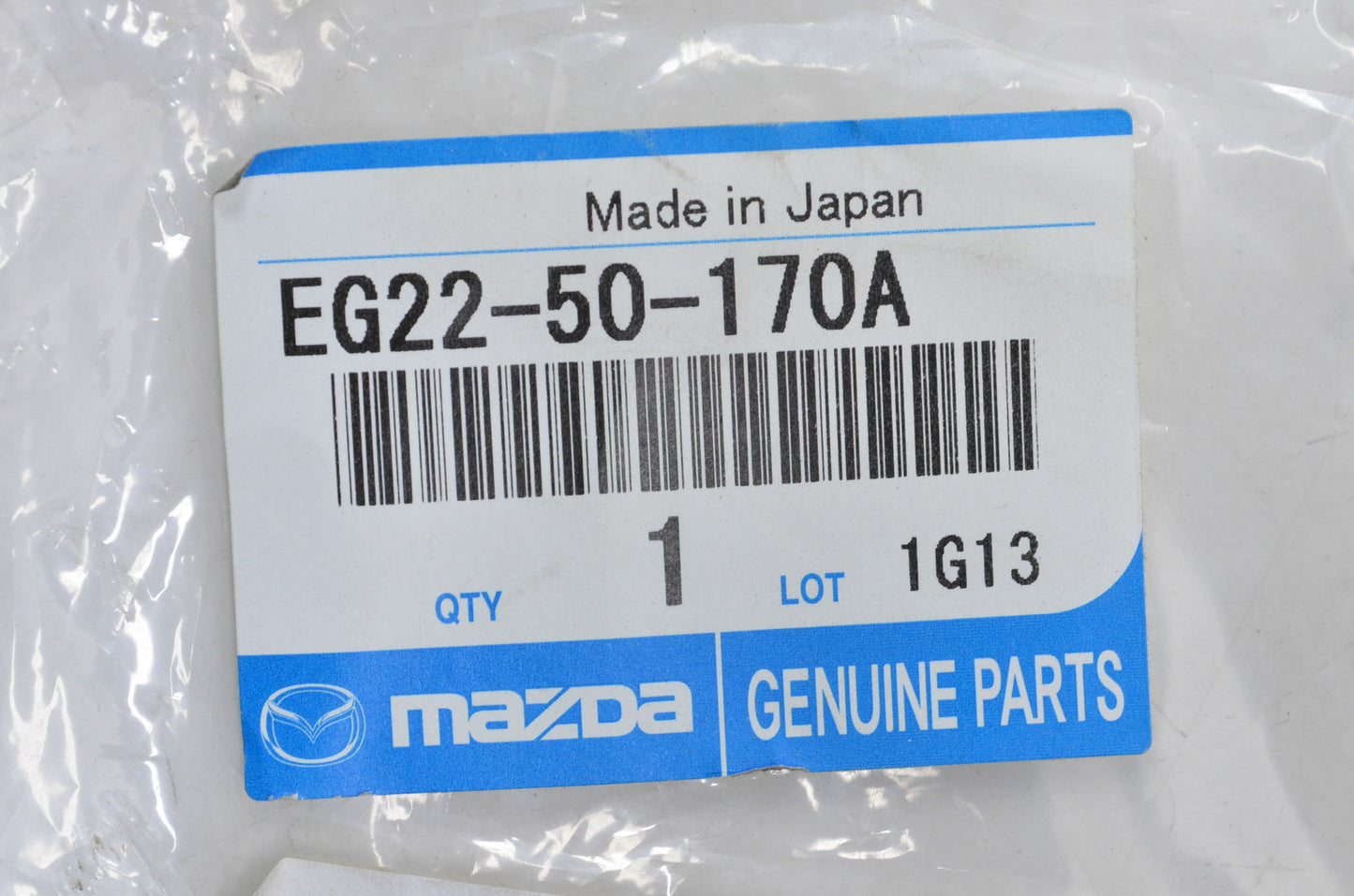 OEM Mazda EG22-50-170A Front License Plate Holder NOS