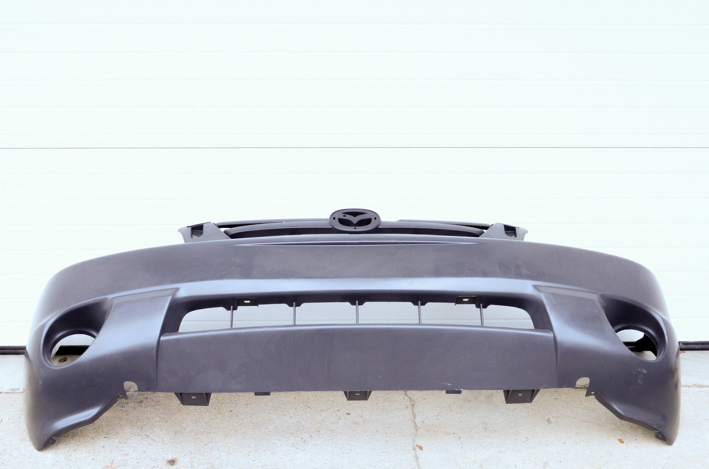 OEM Mazda ECY1-50-031K-BB Front Bumper NOS