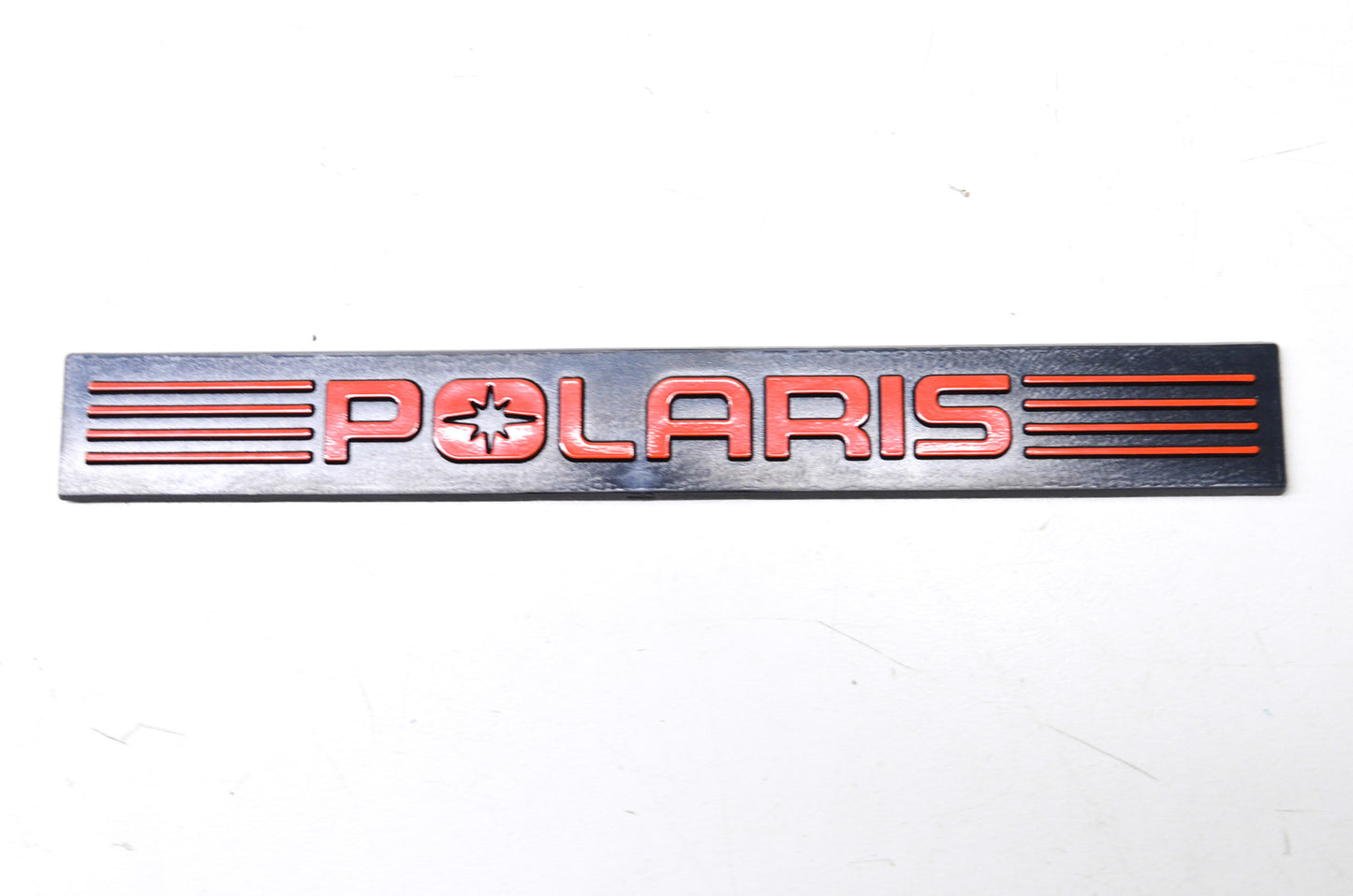 New OEM Polaris Black/Red Bumper Emblem NOS