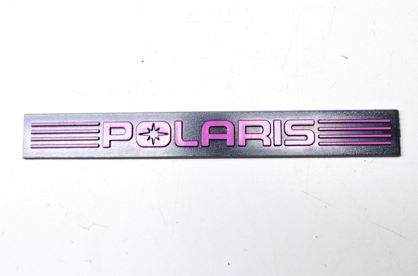 OEM Polaris 5430979-224 Black/Purple Bumper Emblem NOS