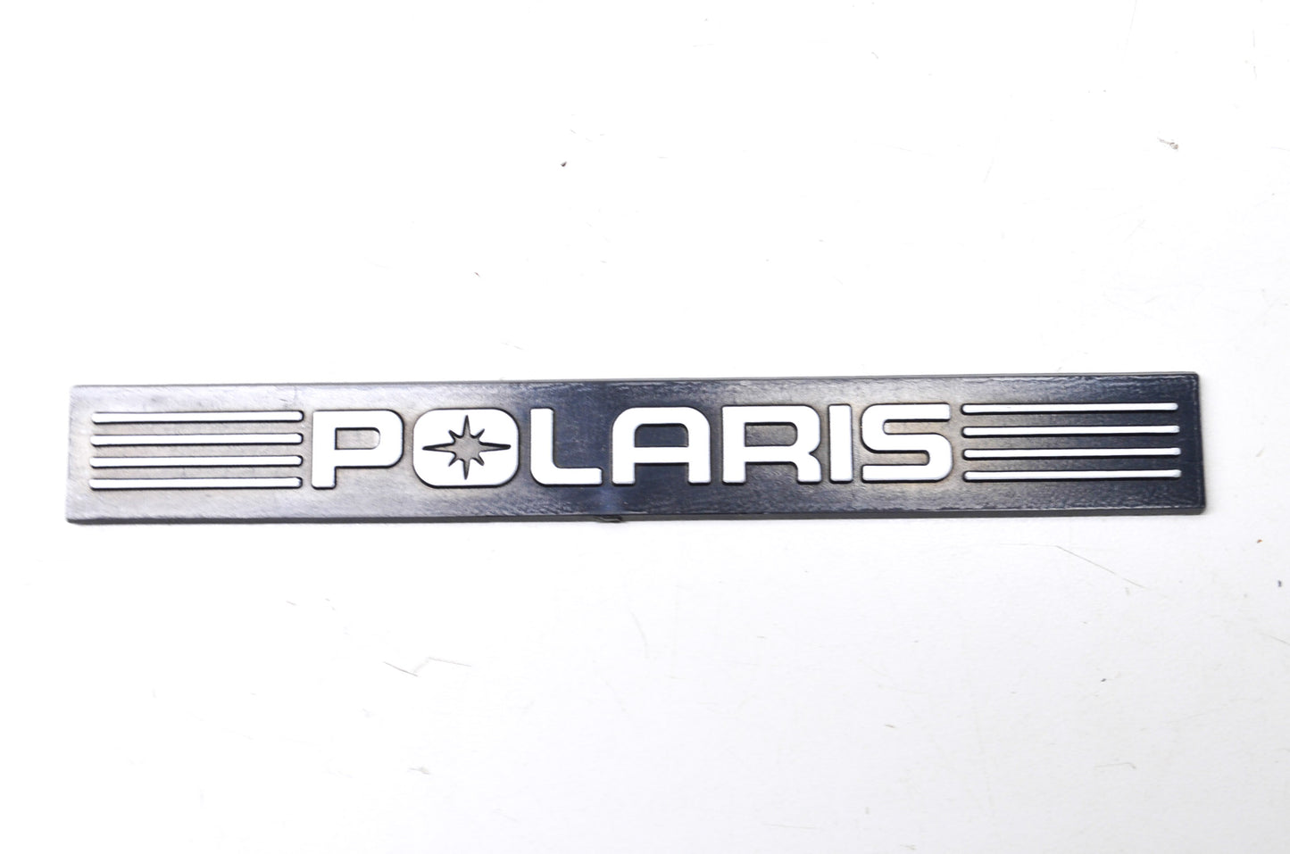 New OEM Polaris Black/Silver Bumper Emblem NOS