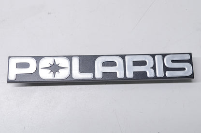 New OEM Polaris 5430724 Black/Silver Bumper Emblem NOS