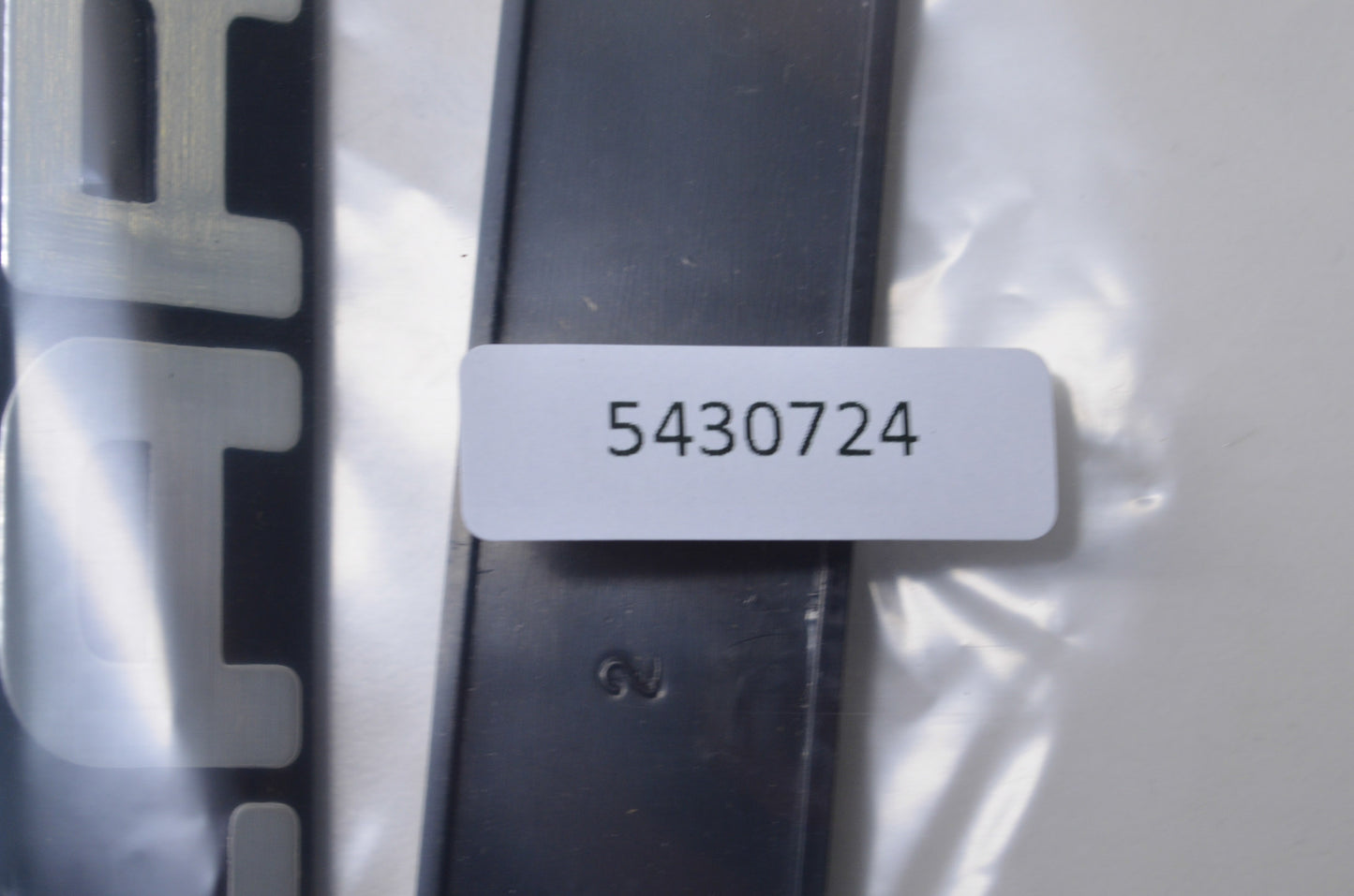 New OEM Polaris 5430724 Black/Silver Bumper Emblem NOS