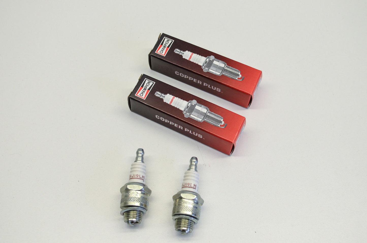 New Champion RJ19LM Spark Plugs Qty 2 NOS