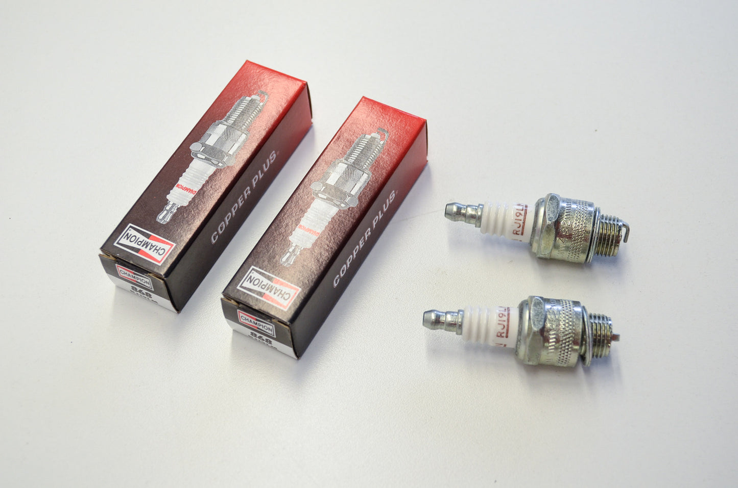 New Champion RJ19LM Spark Plugs Qty 2 NOS
