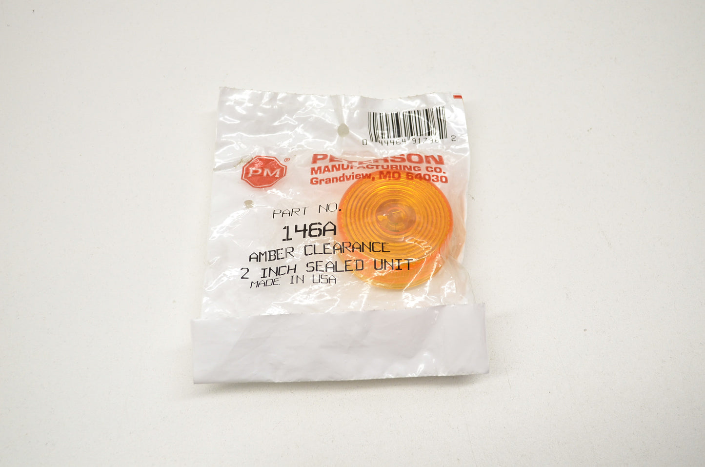 New Peterson Lens Amber 2 inch sealed unit NOS