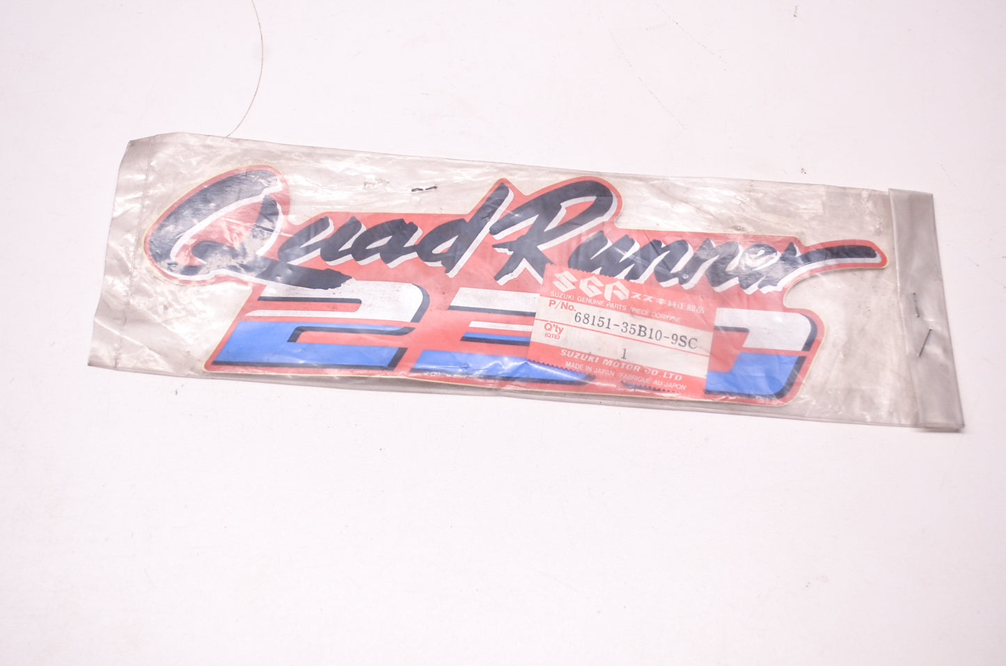 New OEM Suzuki 68151-35B10-9SC Sticker Emblem QuadRunner 230 NOS