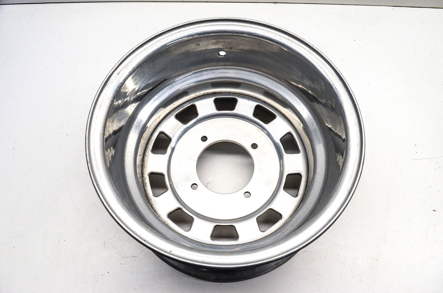 Aftermarket 7x12 Deep Offset 4 Bolt Silver Rear Wheel Rim
