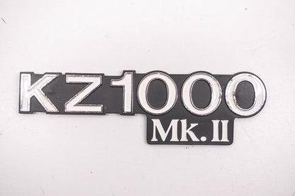 New OEM Kawasaki 56018-1115 KZ1000 MK II Side Cover Emblem NOS