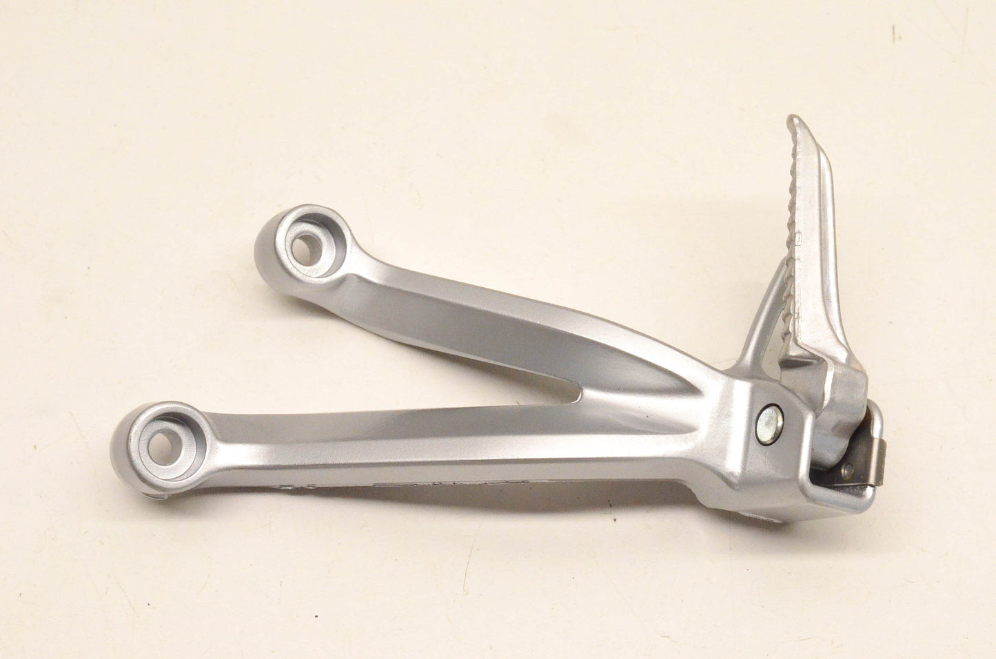 New OEM Suzuki ADC6 35F Rear Footrest Bracket NOS
