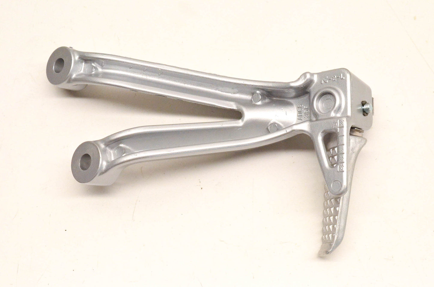 New OEM Suzuki ADC6 35F Rear Footrest Bracket NOS