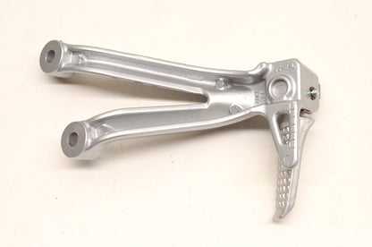 New OEM Suzuki ADC6 35F Rear Footrest Bracket NOS