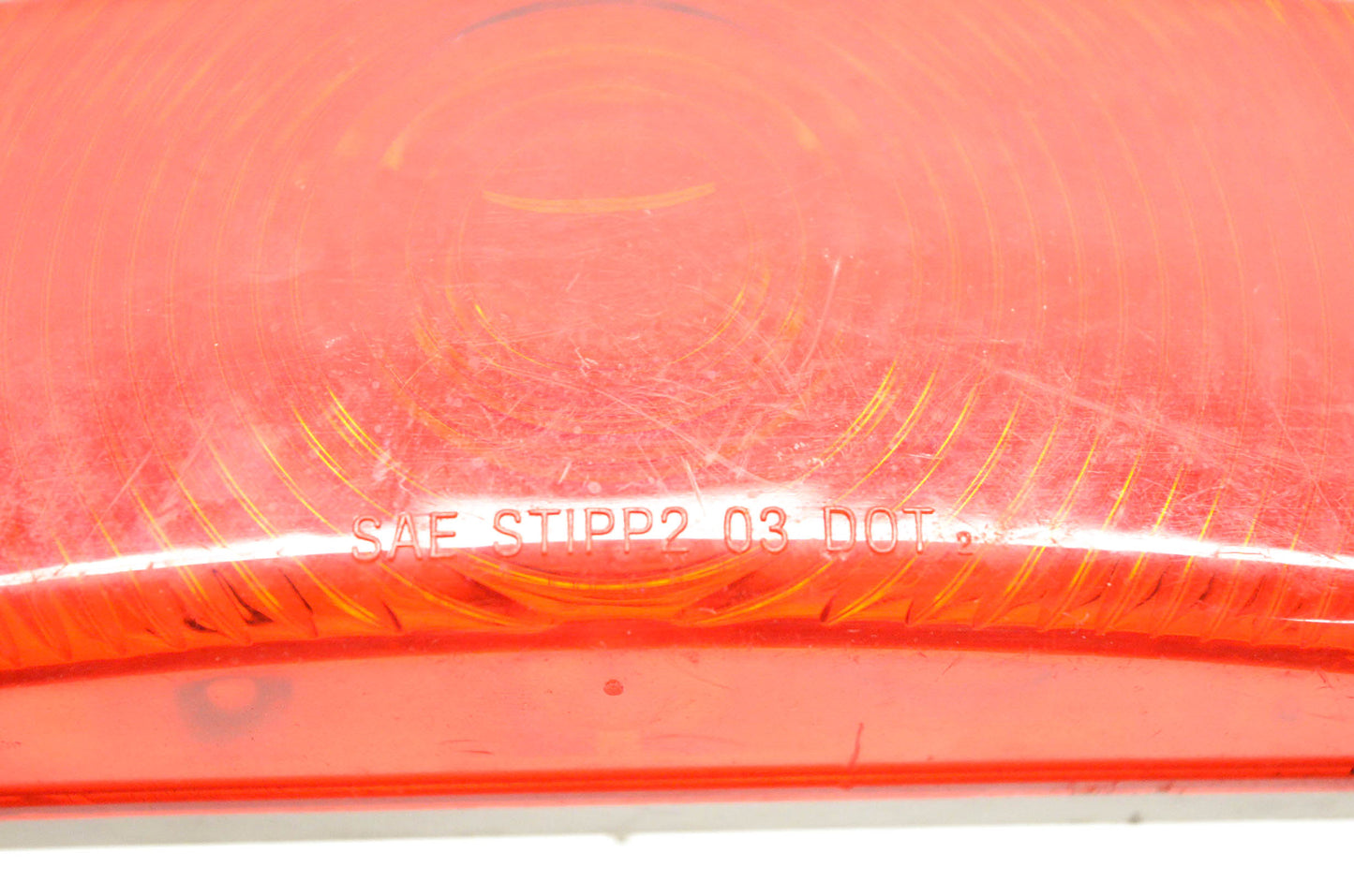 Aftermarket SAE STIPP2 03 DOT Red Oval Lens