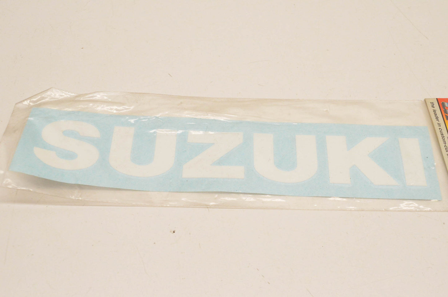 Sticker Point 107026, ST107026 White Suzuki Logo Decal Approx. Size 9"x2" NOS